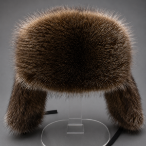Handcrafted Canadian raccoon fur ushanka hat made from premium natural fur with traditional ear flaps for exceptional warmth and timeless winter style.