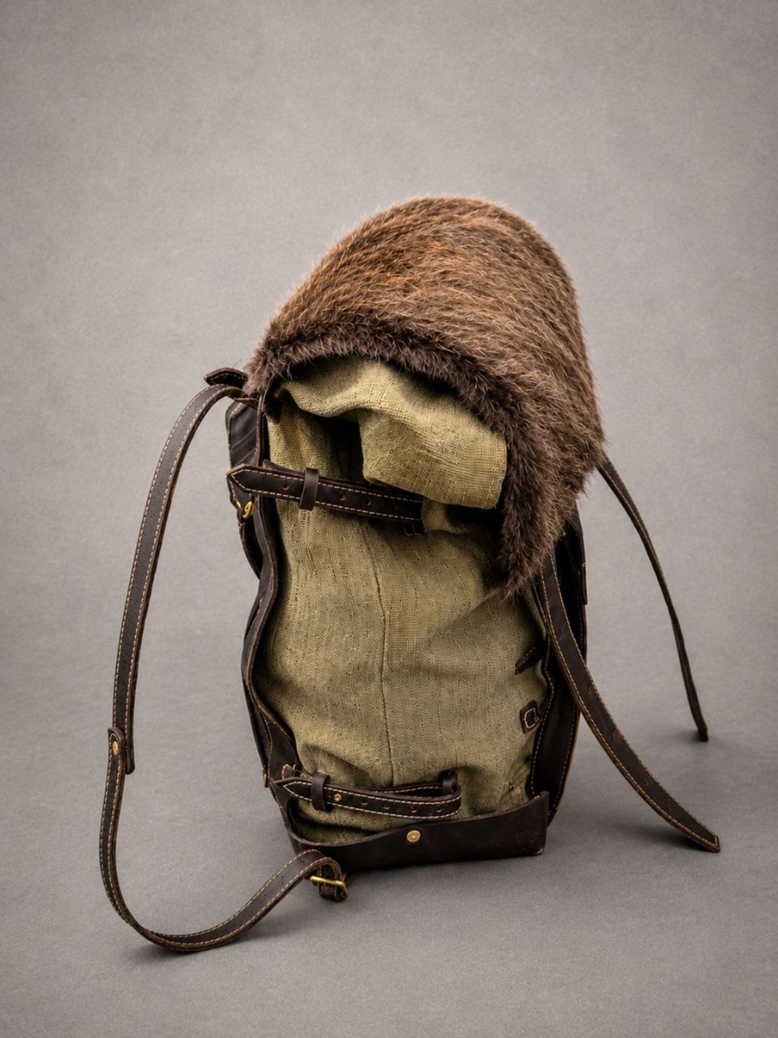Handcrafted beaver fur backpack with waxed canvas body and full-grain leather details.