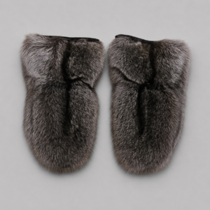 Luxury Canadian raccoon fur mittens in natural grey and black tones with a soft, full fur texture, displayed on a light neutral background. Handcrafted winter mittens offering exceptional warmth and timeless elegance.