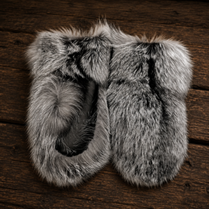 Handcrafted silver fox fur mittens in natural silver and black fur, luxury winter accessory with a soft, full fur texture.
